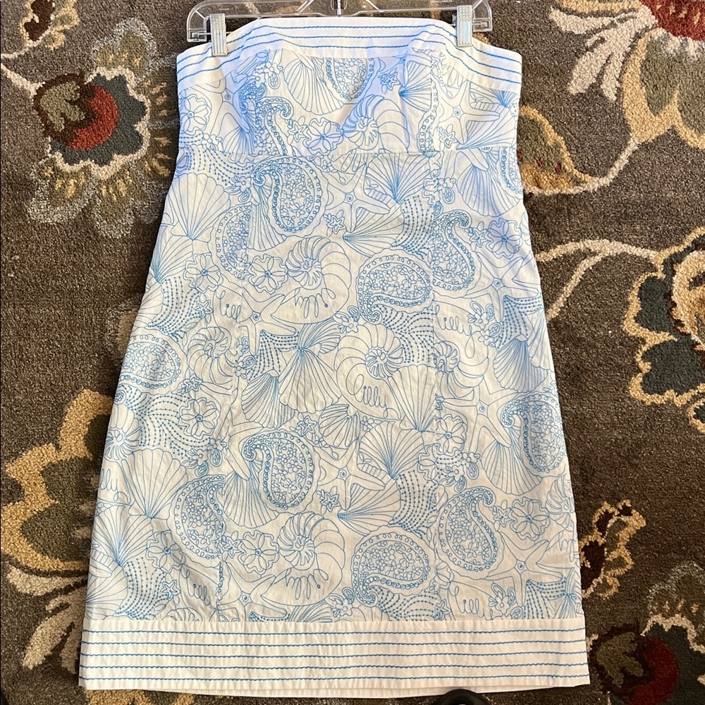 Lilly Pulitzer staples blue, and white sundress and a beautiful seashell design